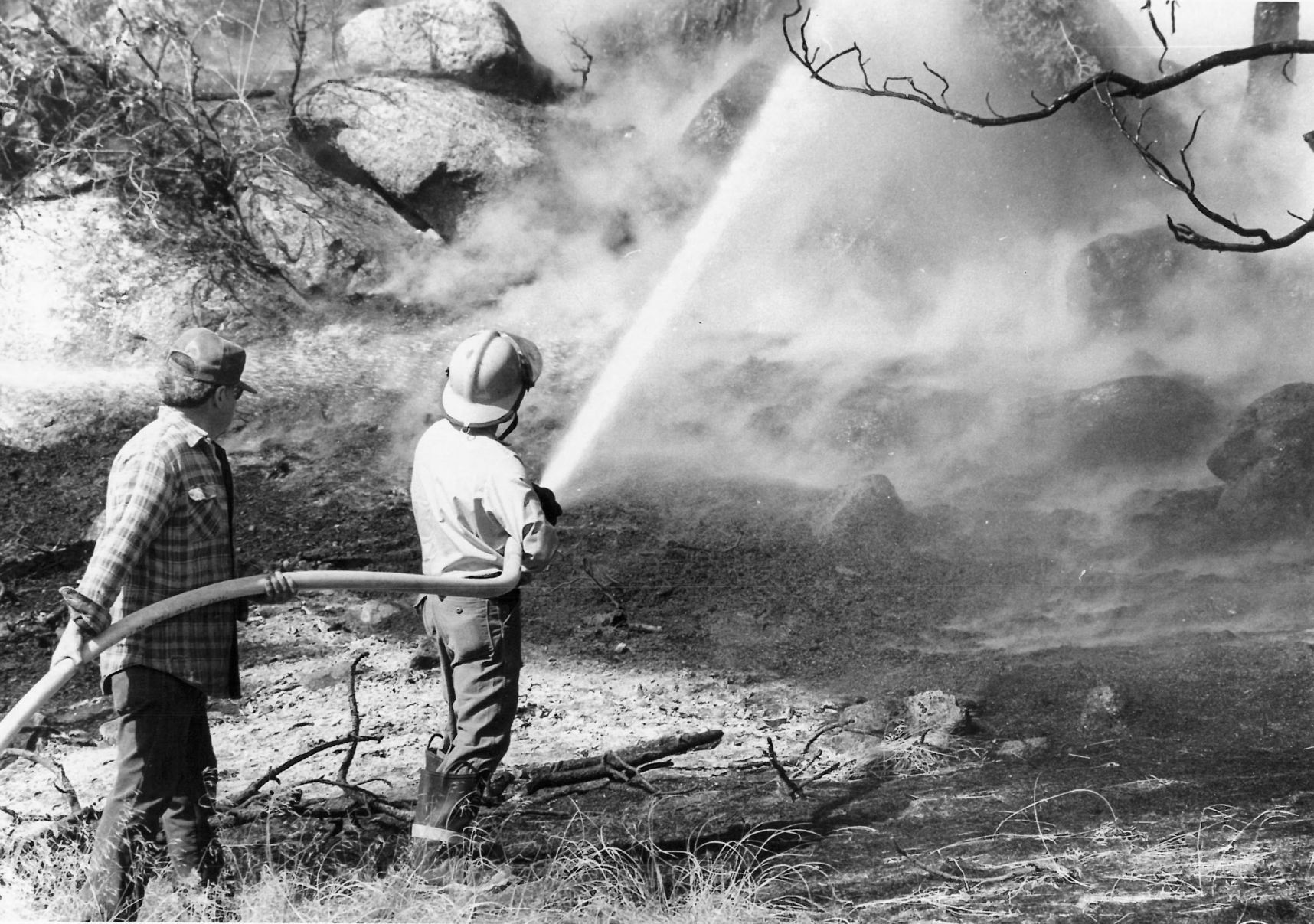 Firefighters work to put out flames